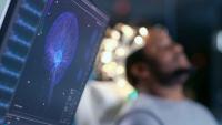 Monitors Show EEG Reading and Graphical Brain Model
